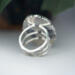 back view, large oval wild horse magnesite gemstone silver statement ring, bezel set with stamped cutout wire accent